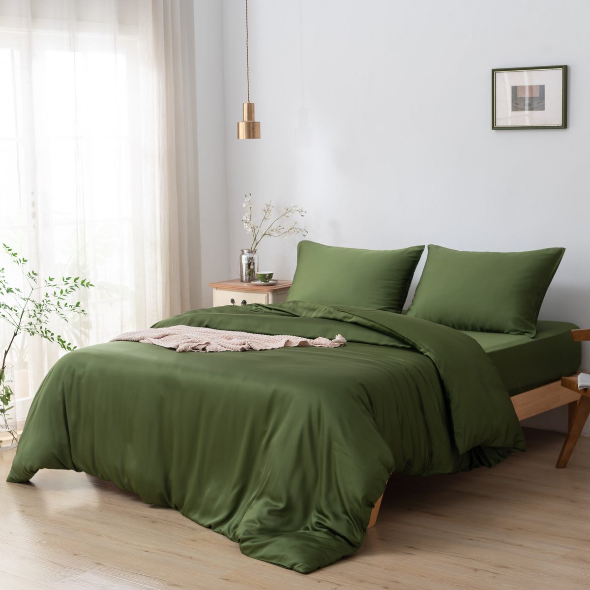 Deep Moss bamboo bedding set styled on a bed in a bedroom setting