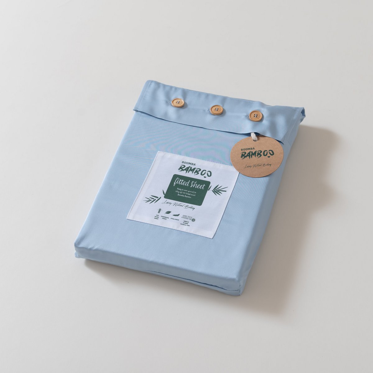 Sky Blue bamboo fitted sheet folded and packaged with the Boomba Bamboo product label.