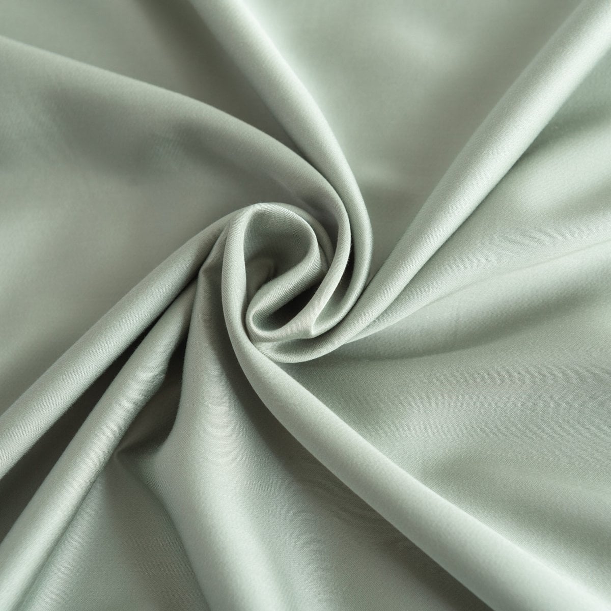 Close-up of swirled Sage Green bamboo fabric