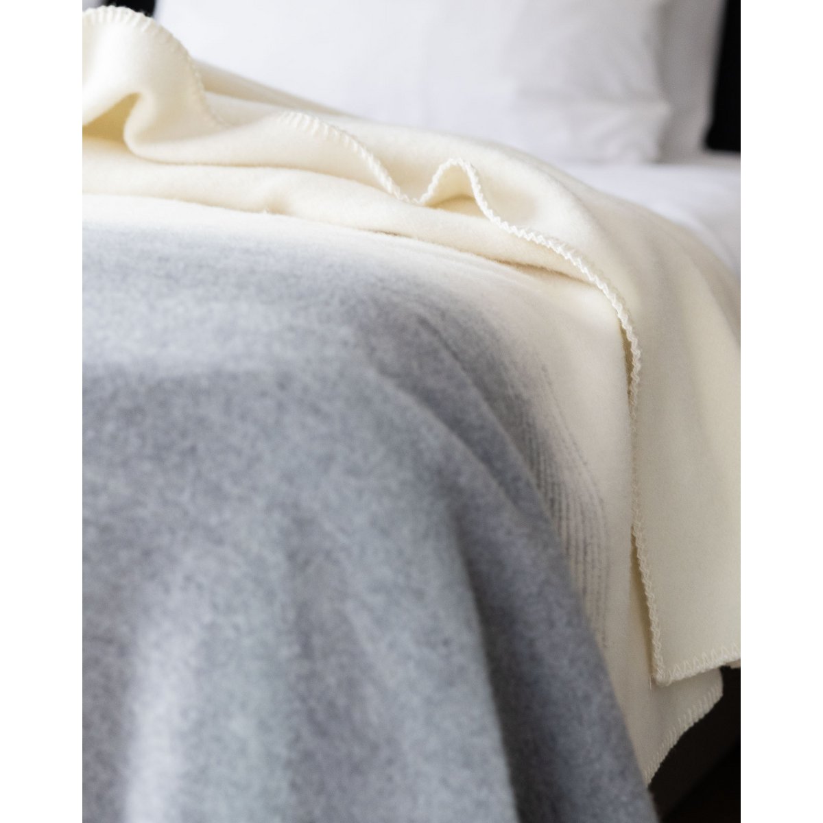Merino & Cashmere Bedspread Ivory Mist styled on a bed
