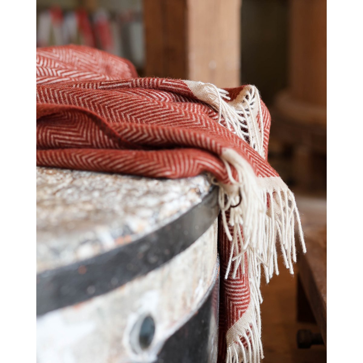 Close-up of Denver throw's striking edge finish in terra