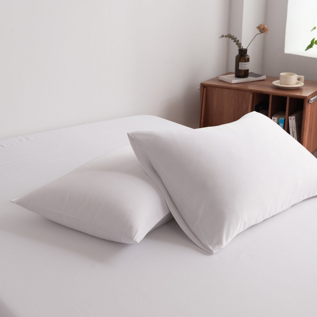 Coco White bamboo bedding set with pillows arranged on the bed