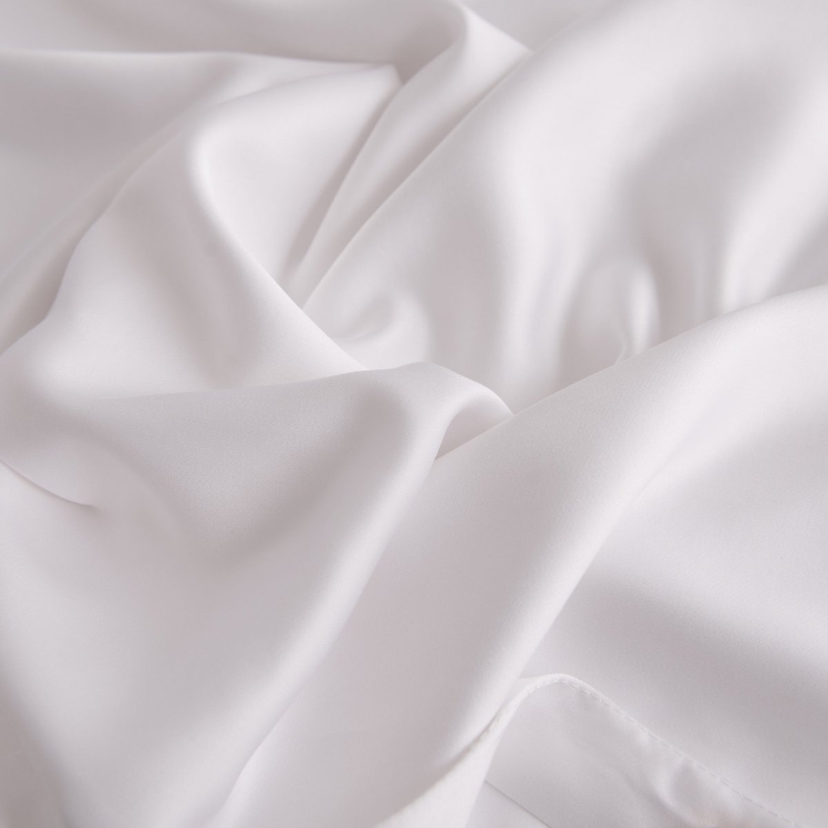 Folded Coco White bamboo fabric showing its natural sheen