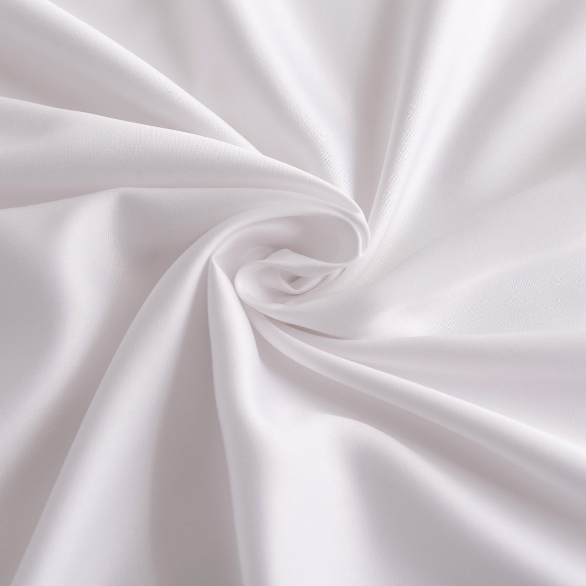 Close-up of swirled Coco White bamboo fabric showing its smooth, silky texture.