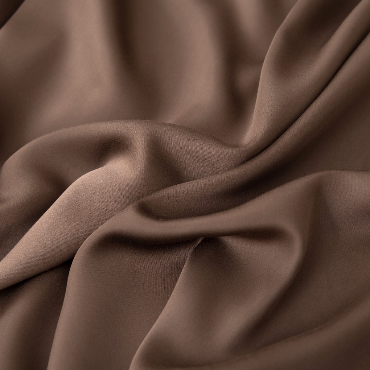 Close-up of swirled Coffee Brown bamboo fabric highlighting its soft sheen.