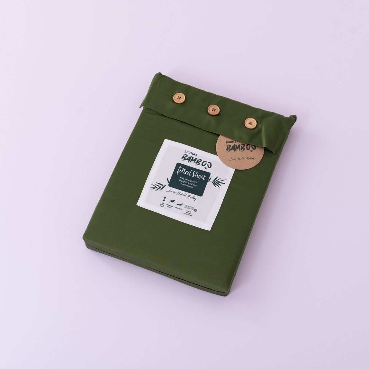 Deep Moss bamboo fitted sheet folded and packaged with the Boomba Bamboo product label.
