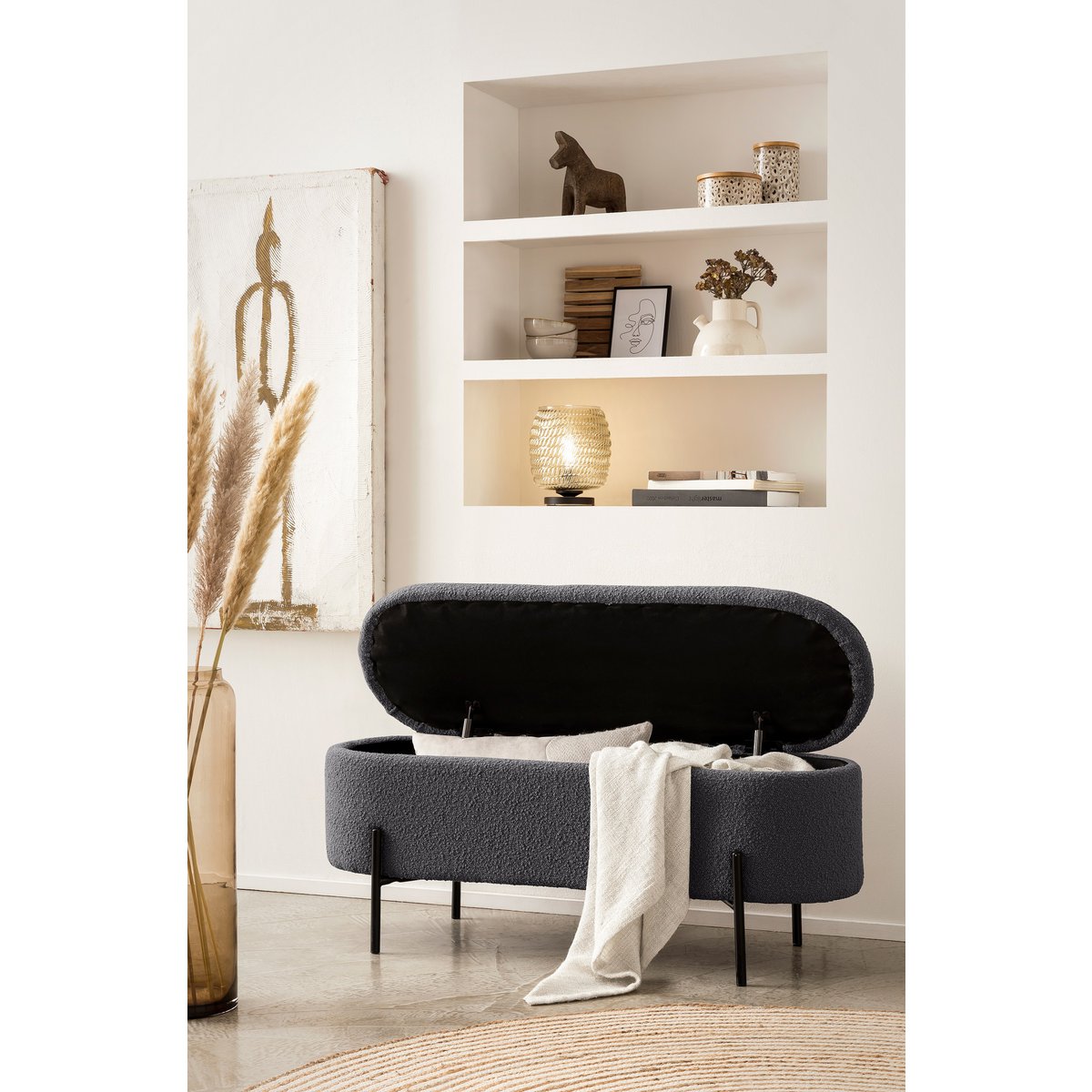 Anthracite bouclé storage bed bench with the lid open and a throw draped over the edge