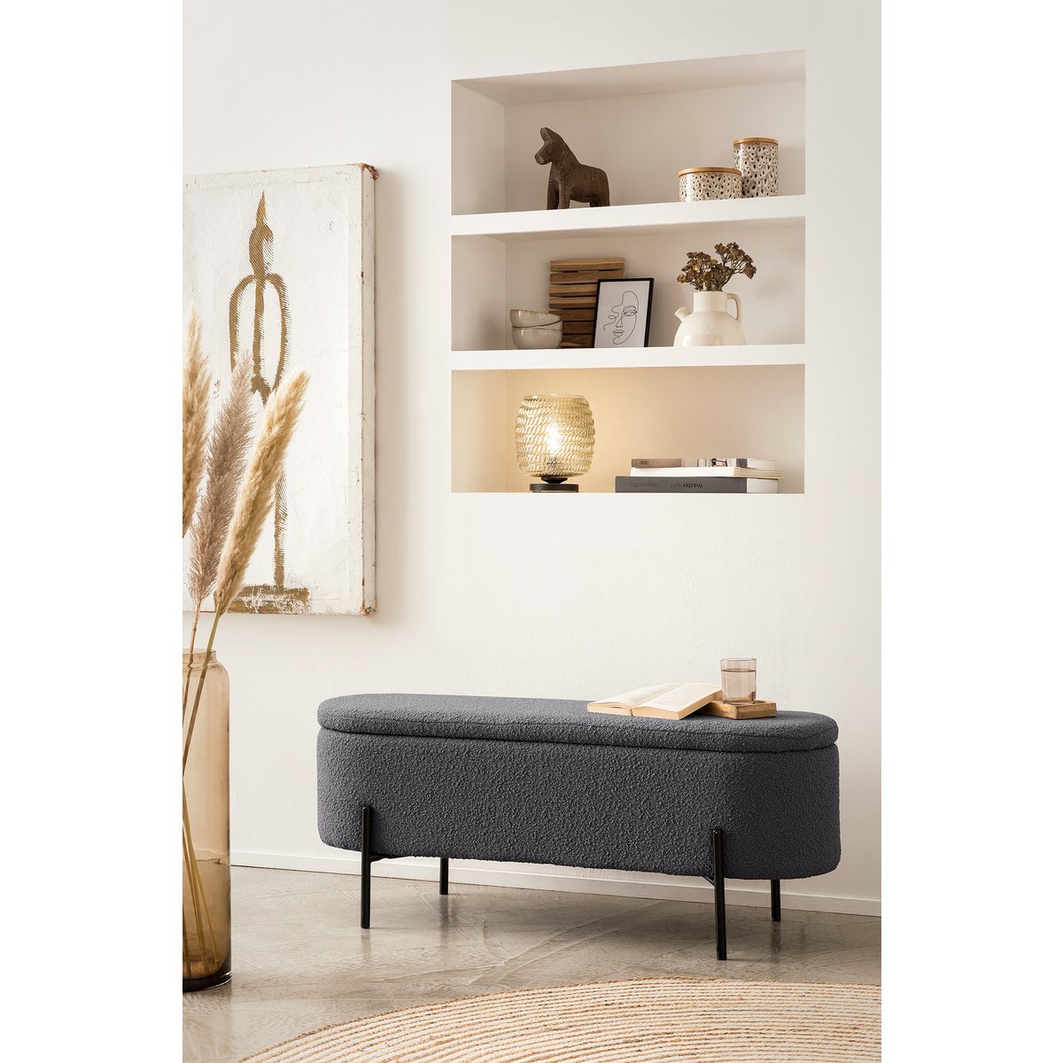 Anthracite bouclé storage bed bench with the lid closed, styled in front of a shelf alcove