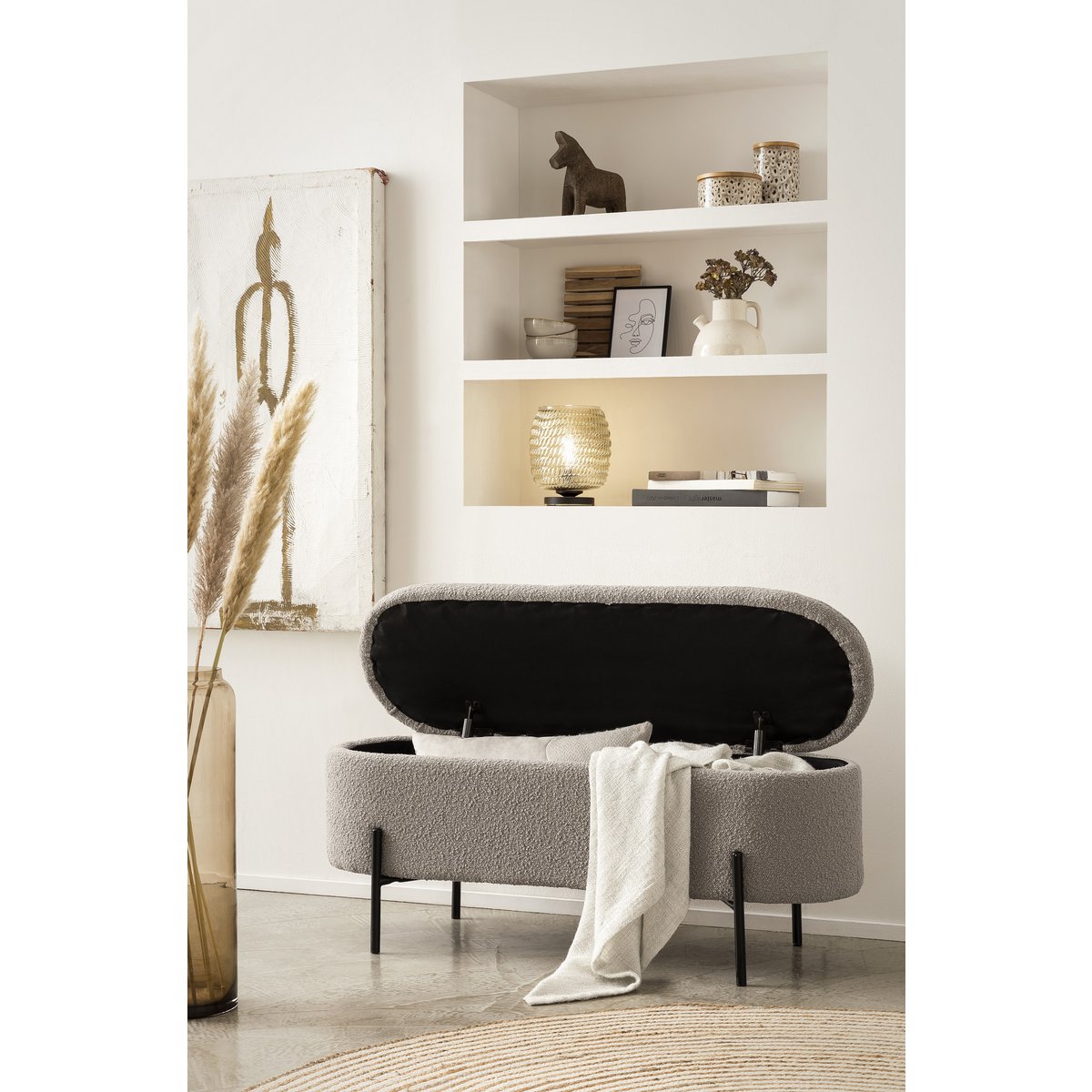 Taupe bouclé storage bed bench with the lid open and a throw draped over the edge