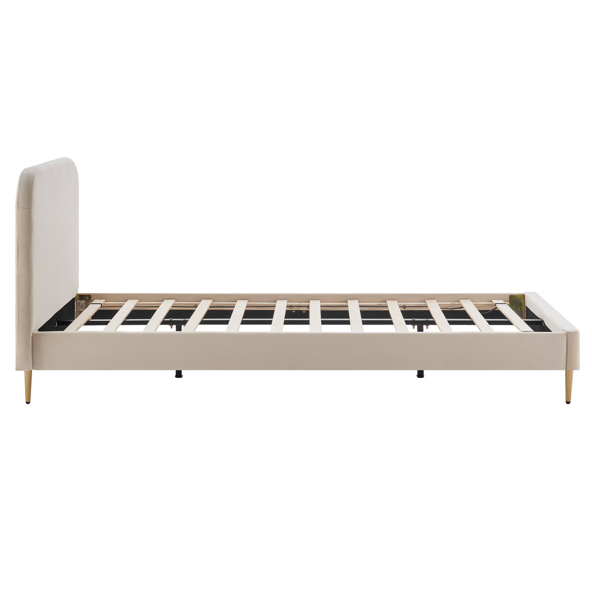 Side view of the beige velvet upholstered bed showing the slatted frame and gold-painted feet