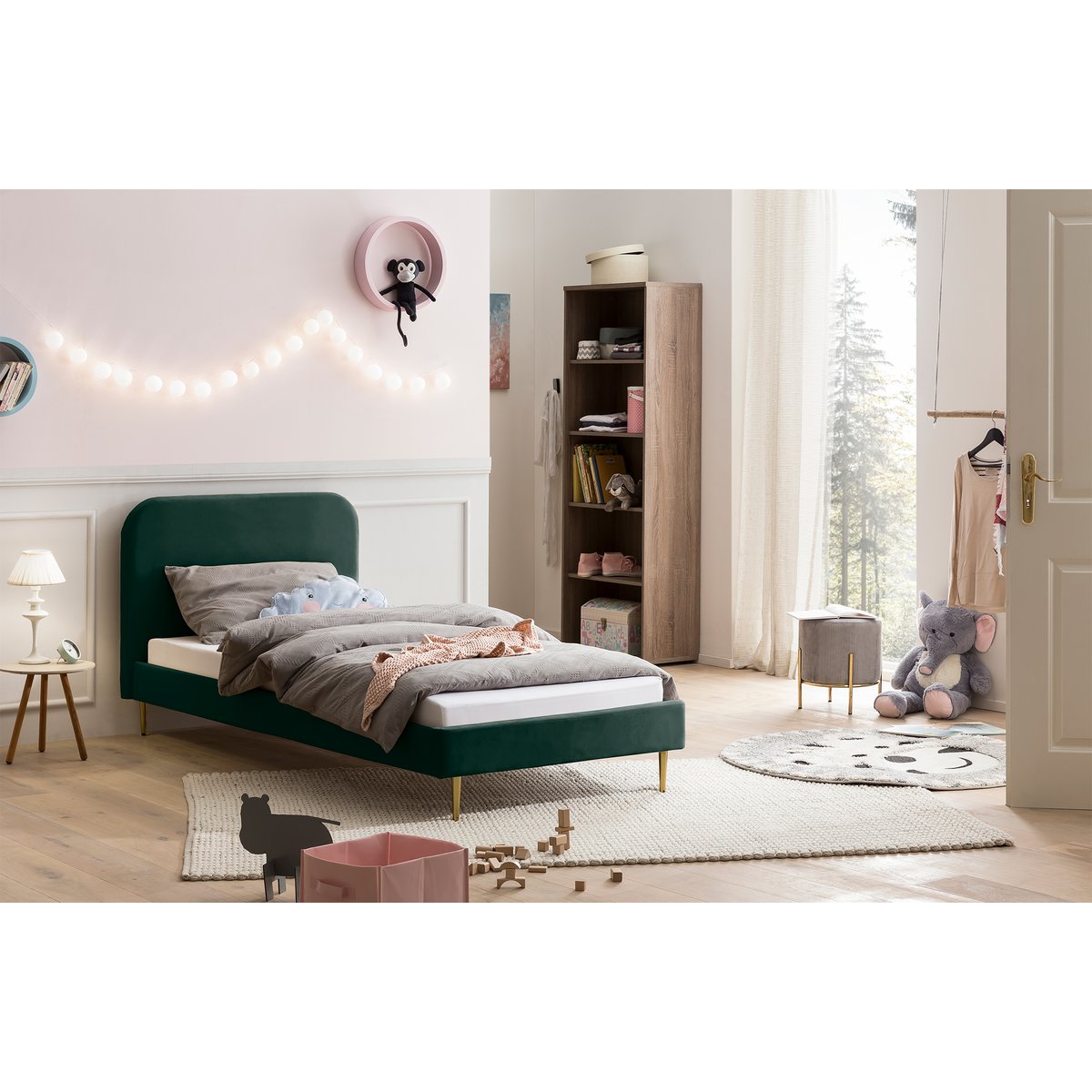 Green velvet upholstered bed 90×200 cm styled in a child's bedroom