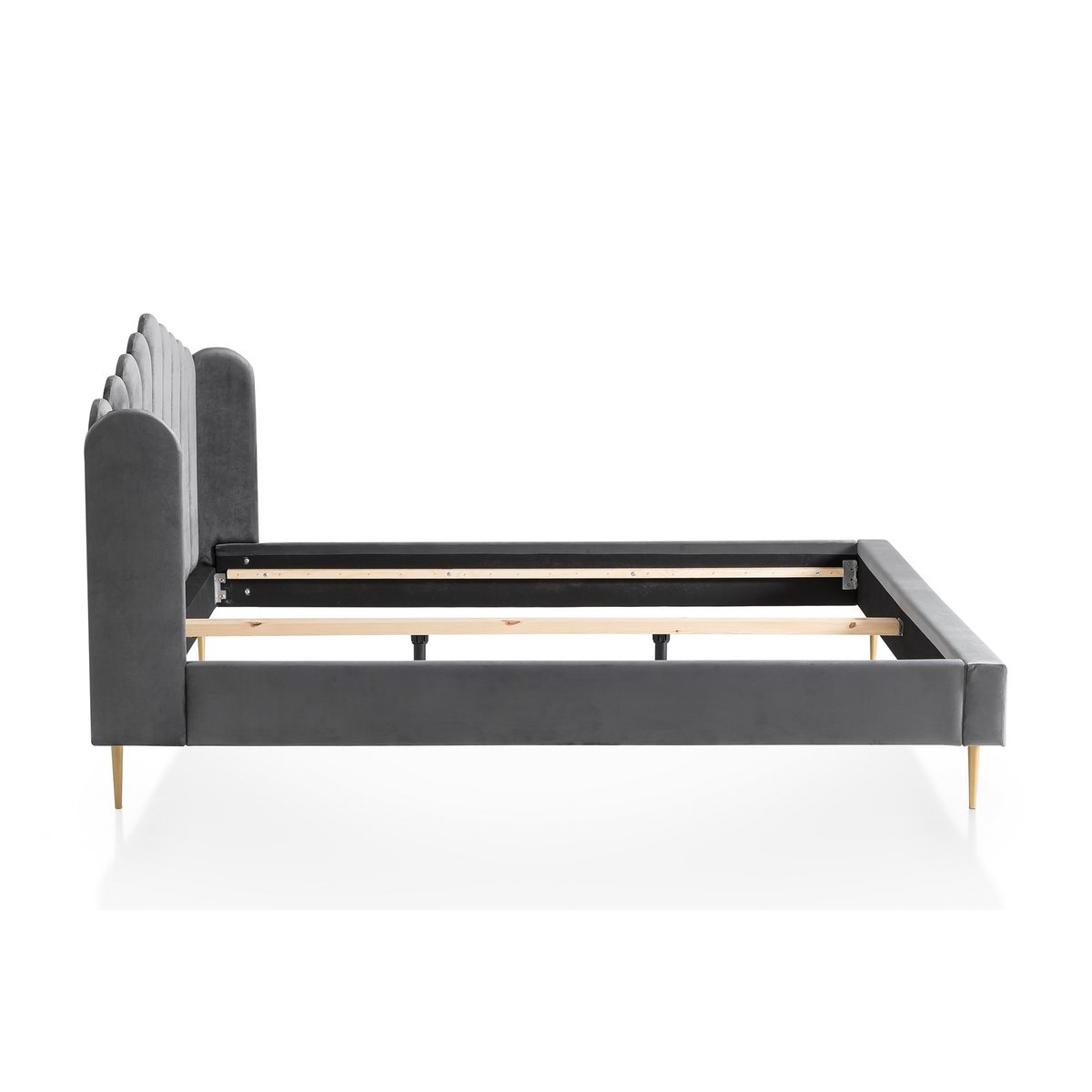 Side view of the grey velvet shell bed showing the headboard profile and gold-painted feet
